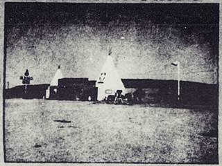 thumbnail of Lupton Yellowhorse tepees black and white 1964 detail of an advert with a gas station and a store flanked by two tepees