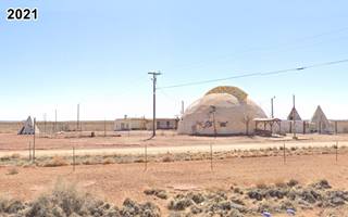 Meteor City 2021 dome, tepees, fences, arid country seen from freeway