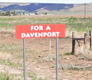 Burma sign on Route 66 in Seligman AZ Burma Shave advertisement: red sign with white letters on highway shoulder