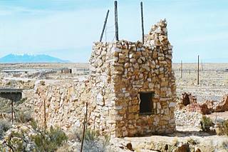 Apache Death Caves nowadays, Two Guns AZ color view of a stone tower in ruins