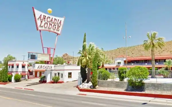 motel with red and white sign 2-story
