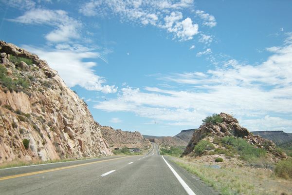 Historic Route 66 winding between arid hills