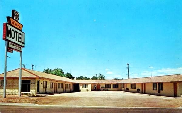 Aztec Motel vintage postcard: U shape layout, colorful neon light, gable roof single floor units