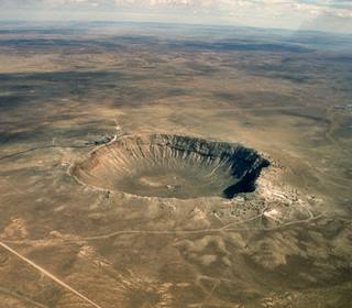 Barringer meteor crater Barringer crater seen from the air surrounded by desert