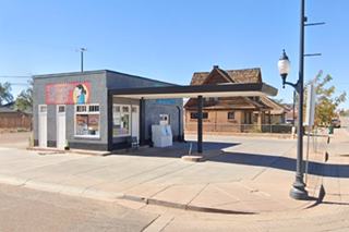 box shaped, flat canopy 1950s gas station, nicely restored as a store