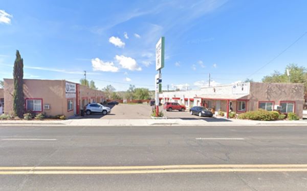 single story stone buildings, a 1930s motel in Seligman AZ