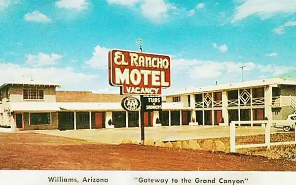 1950s postcard: 2- story motel, red neon sign with white letters