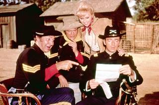 Cast of F troop color picture 3 men in US Cavalry uniforms and a woman on a set