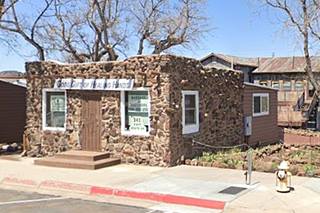 roughly hewn stone building, block-shaped