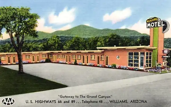 1950s postcard flat-roofed motel, pink, corner office. Tower topped by neon sigh