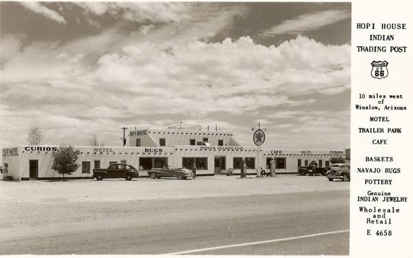 black and white 1940s postcsard, trading post and texaco, cars