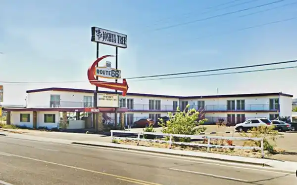 former Pony Soldier Motel nowadays US66 neon sign, 2-story apts.