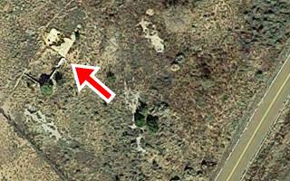 Log Cabin Trading post satellite view 2023 rubble of foundations marked with red arrow in a satellite picture, highway lower right corner