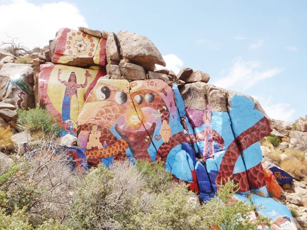 mural artwork painted on rocks in the outdoors