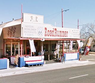 former Olson Chevrolet and Shell nowadays, Seligman AZ color photo gift shop with flat canopy and Route 66 in foreground