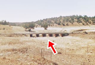Old bridge Route 66 Peach Spgs AZ bridge and embankment in the distance seen from modern US66