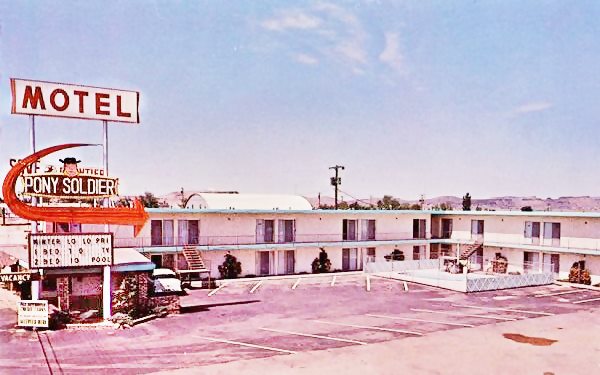 Vintage postcard of the Pony Soldier Motel, car, neon sign and pool