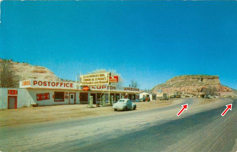 Lupton Post Office, Chevron and Trading Post 1950s long one-story building, 5 Chevron pumps, vintage car the road forks beyond, US66 in the 1950s