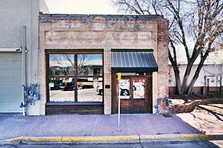 brick building, phantom words on facade: Red Cross Garage