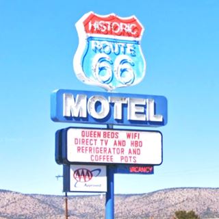 Route 66 Motel neon sign blue and red Route 66 shield with white letters, a classic neon sign