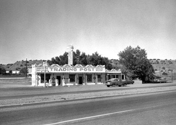 black and white postcard, long single floor building, gas station,seen from Route 66