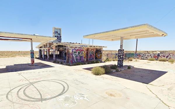 gas station, vacant and covered with graffiti
