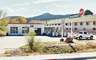 1960s box-shaped gas station 3 service bays, flat canopy, glazed office. 2016