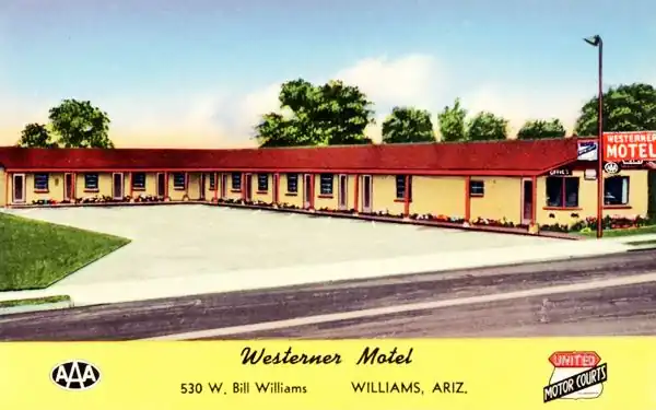 postcard gable roof motel, L shaped layout, red neon sign, trees