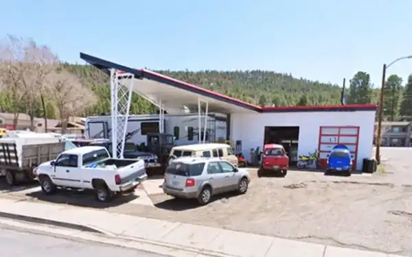gull wing canopy gas station, cars parked