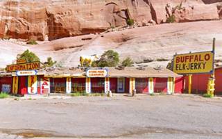 single floor gift shop painted yellow with a yellow horse on the roof