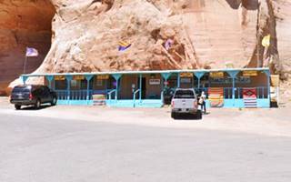 single floor turquoise colored trading post by route 66