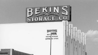 black and white, 1997. Sign atop a roof reads BEKINS STORAGE CO