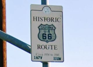 rectangular white marker sign reads "Historic Route 66, Circa 1934 to 1941" with a California US 66 shield in it