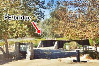 original 1930s Pacific Electric (PE) bridge, Cucamonga steel span of a bridge in a park, Fall trees