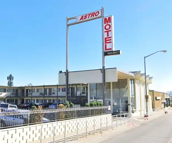 Atro Motel, San Bernardino 2 story white and red letters neon sign, sawtooth roof motel