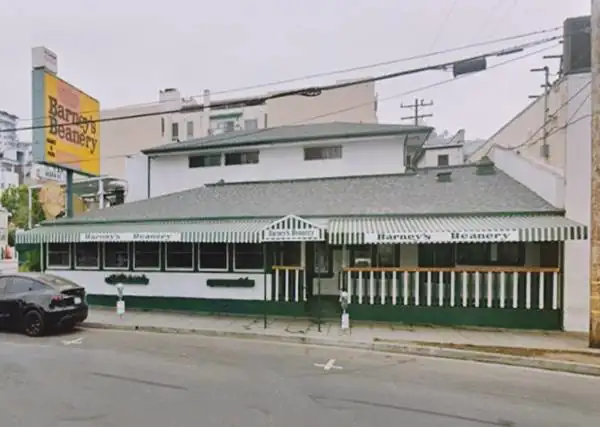 green and white single story building, sign reads Barneys Beanery