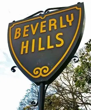 Beverly Hills Sign brown sign, yellow letters spell Beverly Hills