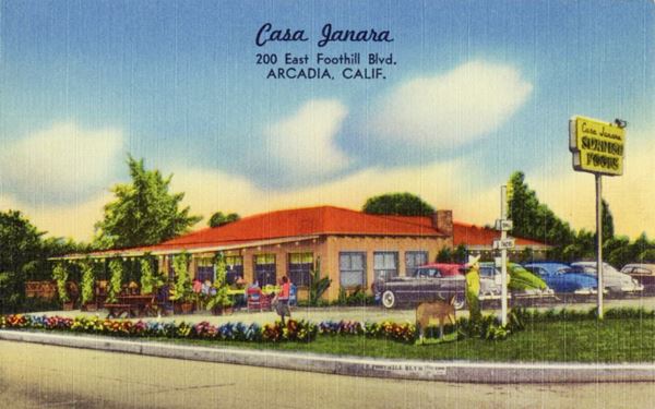 Casa Janara 1950s Arcadia CA Route 66 1950s linnen color postcard, hip roof restaurant, lateral verandah with tables and people eating, cars parked to the right, garden with flowers, trees