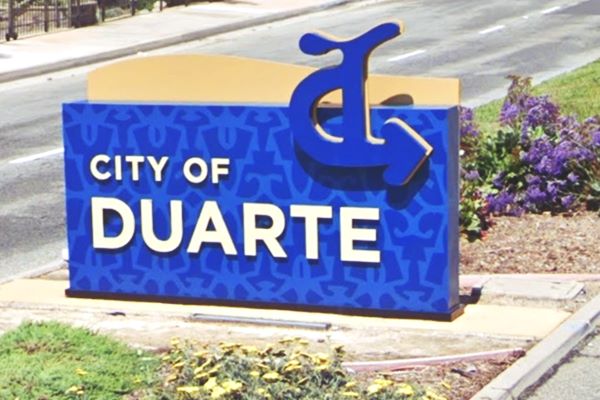 City of Duarte sign on Route 66 sign in blue and white reads CITY OF DUARTE, in the median of Route 66