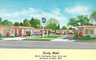 Derby Motel postcard c.1950s Arcadia Rte 66 linnen postcard c.1950, cars parked in flat roofed garages between units of a motel sign reads DERBY MOTEL in white letters on blue. US 66 runs across image