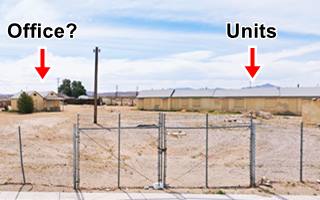 Do Drop Inn motel units nowadays line of motel units, boarded windows and doors, gable roof, 1 story, sandy drive, cabin or office to the left