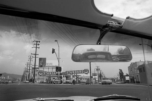 1948 US66 in Beverly Hills black and white, service station, US 66 shield, buildings and billboard