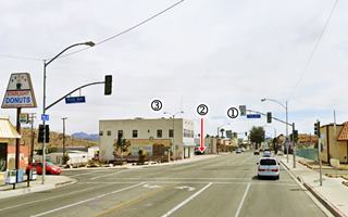 Downtown Barstow nowadays cars, street, buildings, empty vacant lots
