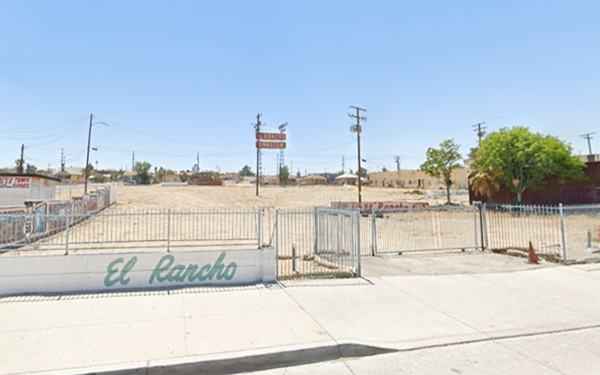 El Rancho motel Barstow in 2023 US 66 razed plot of land, no buildings, only a tall motel sign at the back