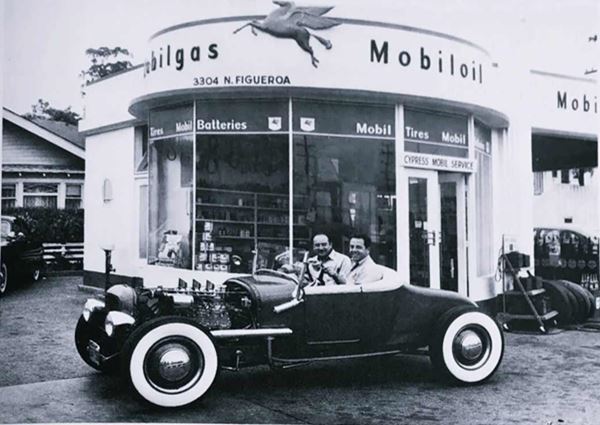 Cypress Mobil Service, c.1950 Los Angeles CA Route 66 black and white photo, 1950s two men in a hot rod, in front of a Mobile service station with rounded office, address is shown as 3304 N Figueroa. Pegassus on office wall, over doorway it says CYPRESS MOBIL SERVICE