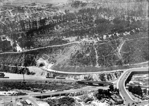Figueroa St. at Riverside Drive, Los Angeles c.1930s black and white, aerial view, tunnel in hilly terrain left, roads and bridge