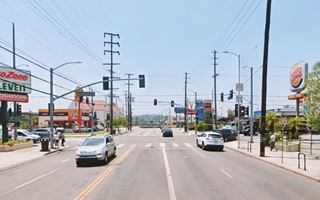 color, 2024, road intersection, signs, cars, Dutch style buildings to the upper left