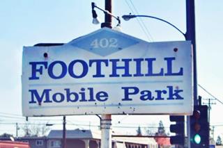 color sign on a post of the FOOTHILL TRAILER PARK