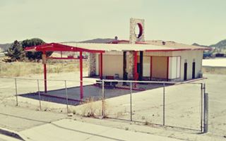 1960s gas station on US 66 Devore ranch style gable roof canopy and building, Shell or Texaco station c.1960s. stone faced, 1 service bay
