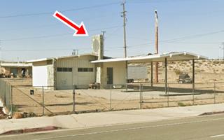 ranch style gable roof canopy and building, Shell or Texaco station c.1960s. stone faced 2 service bays